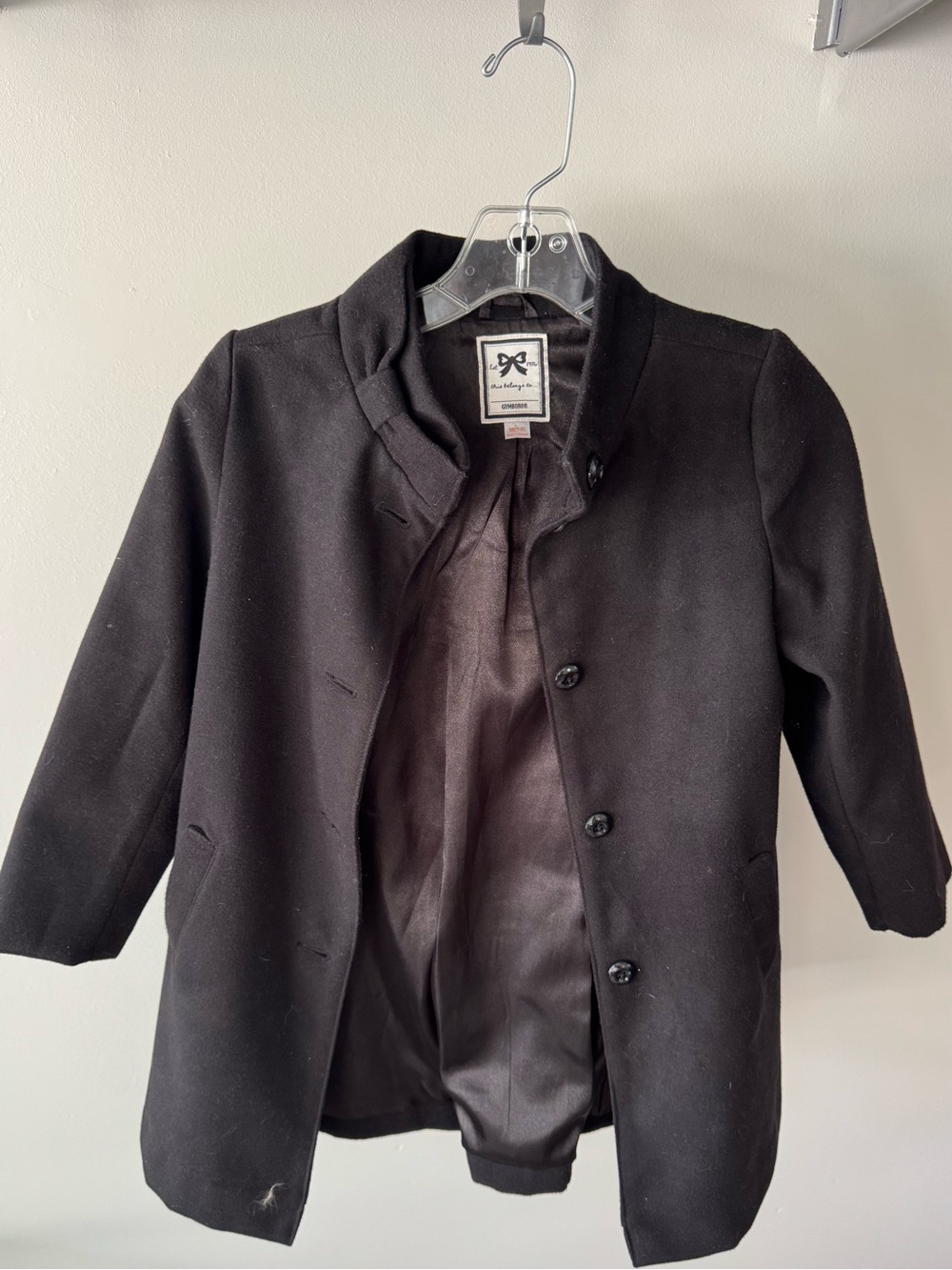 Gymboree girls' black winter coat with a bow detail at the neck